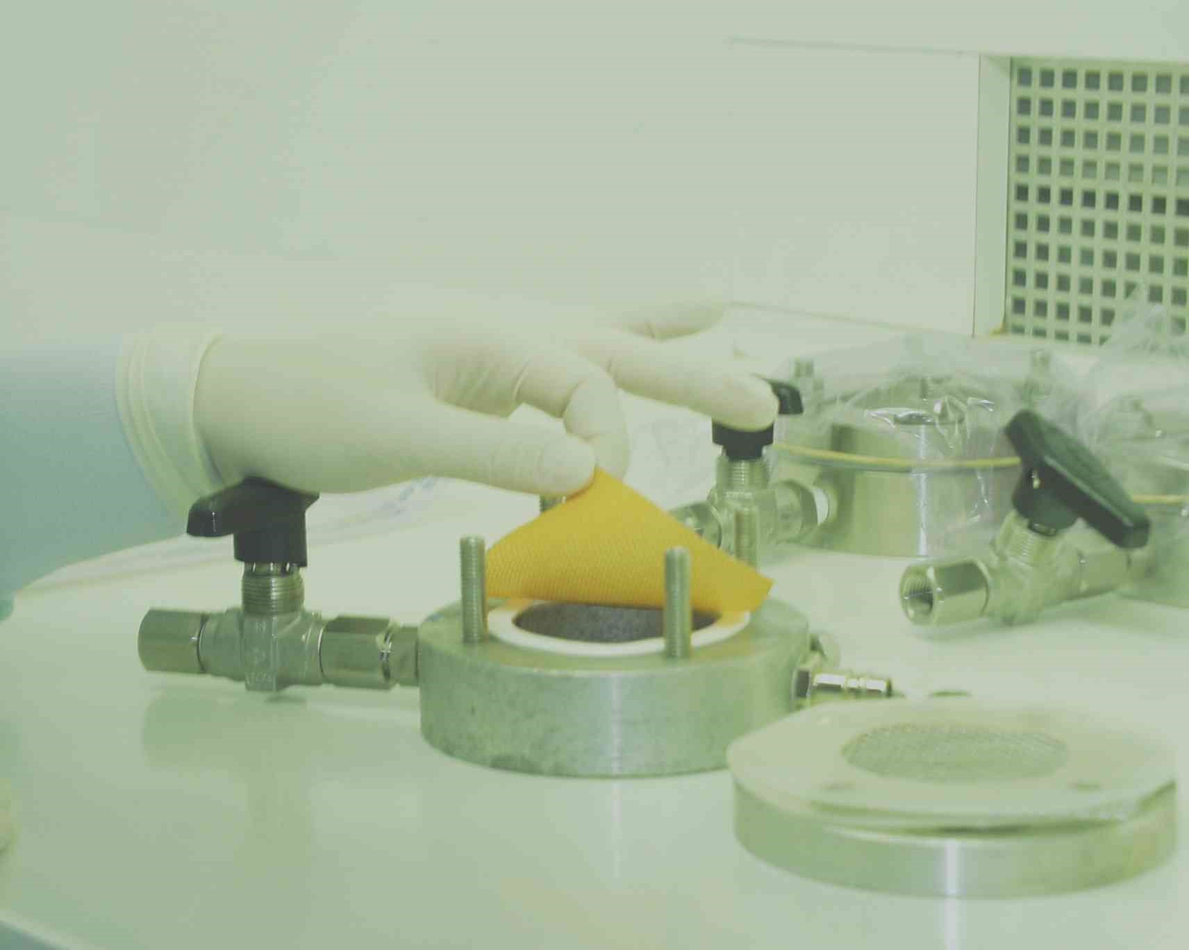 Sample of disposable glove placed in a viral penetration test cell